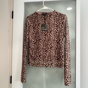 See you Monday sheer animal print top.